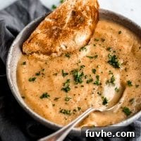 Easy vegan roasted garlic cauliflower soup with fresh bread.