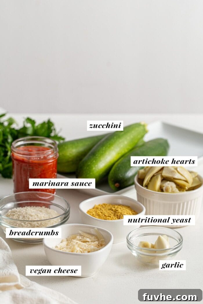 Ingredients for making stuffed zucchini boats labelled with text overlay, neatly arranged on a counter.