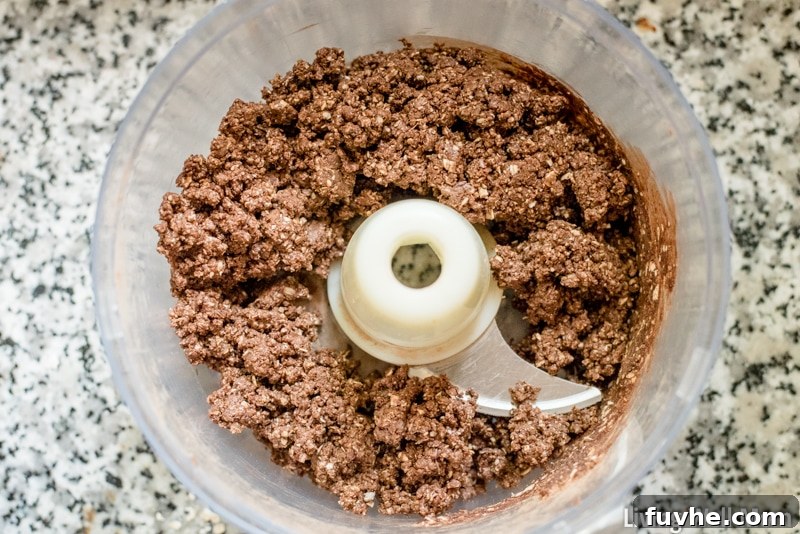 mixing chocolate protein balls in a food processor