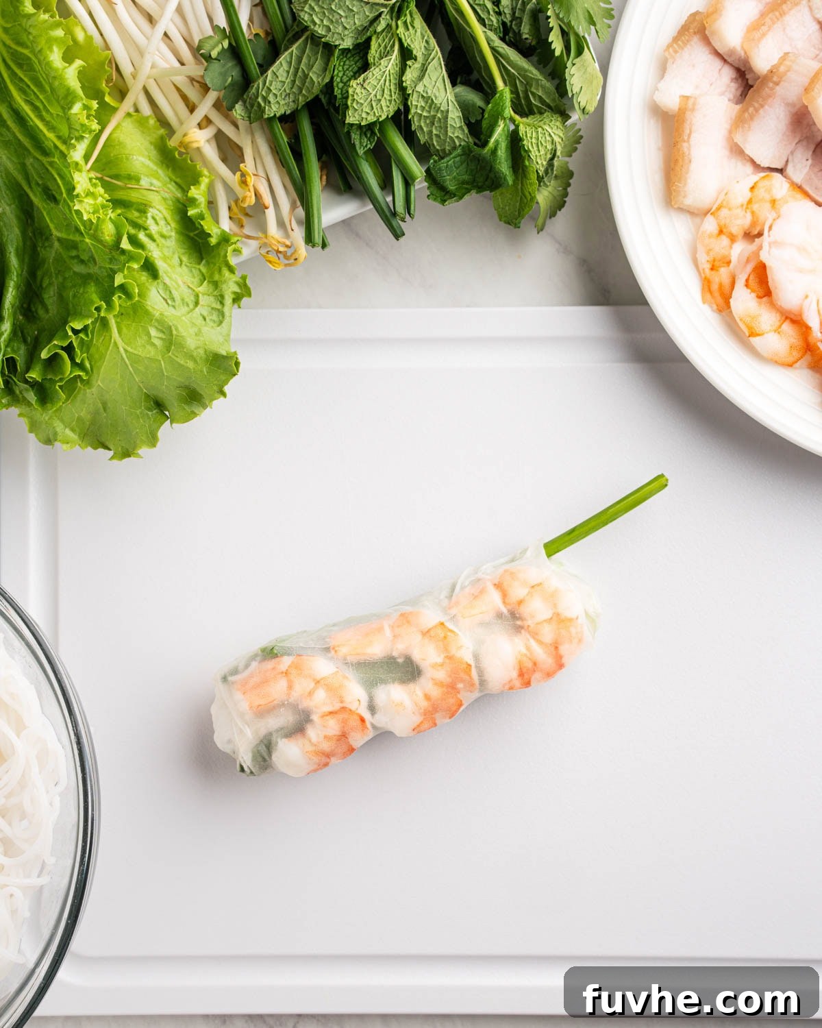 Vietnamese Fresh Spring Rolls (Gỏi Cuốn) — Authentic Recipe 14 wrapped spring roll on a cutting board.